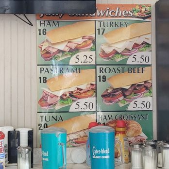 Jolly Donuts - a counter with a television above it - Donuts Near Me - Canoga Park, California