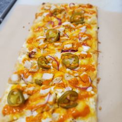 The Main Squeeze Cafe - Buffalo Chicken Pizza with jalapenos, onions, blue cheese and buffalo sauce.
