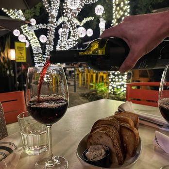 Glass & Vine - Bottle of wine and bread - New American Near Me - Miami, Florida Glass & Vine - Bottle of wine and bread - New American Near Me - Miami, Florida