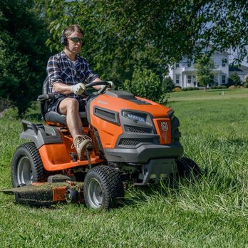 Joe's Engine Shop - Man mowing grass with Husqvarna tractor lawnmower. - Outdoor Power Equipment Services Near Me - Bremen, Indiana Joe's Engine Shop - Man mowing grass with Husqvarna tractor lawnmower. - Outdoor Power Equipment Services Near Me - Bremen, Indiana
