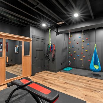 Kurber Construction - Custom basement remodel in New Berlin with dedicated home gym and modern industrial design. - General Contractors Near Me - Waukesha, Wisconsin Kurber Construction - Custom basement remodel in New Berlin with dedicated home gym and modern industrial design. - General Contractors Near Me - Waukesha, Wisconsin