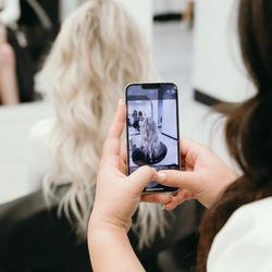 Hello Beauty Lounge - Friendly, professional hair stylists and nail technicians pose together in the modern, chic salon