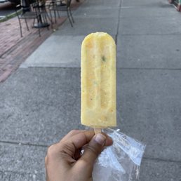 a hand holding a popsicle a hand holding a popsicle