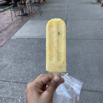 Zora Dora's Micro Batch Ice Cream and Paletas - a hand holding a popsicle - Ice Cream & Frozen Yogurt Near Me - Beacon, New York Zora Dora's Micro Batch Ice Cream and Paletas - a hand holding a popsicle - Ice Cream & Frozen Yogurt Near Me - Beacon, New York
