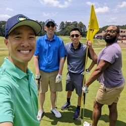 RiverPines Golf - Happy Mother's Day 2023! Foursome selfie on the 9th green with the RiverPines Golf clubhouse in the background.
