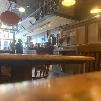 Bean Around the World - a table and chairs in a restaurant - Coffee & Tea Near Me - Victoria, British Columbia