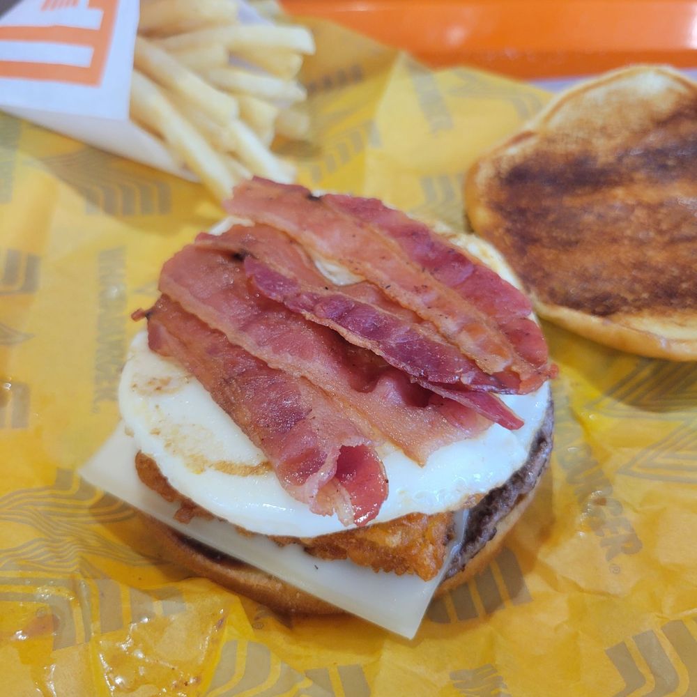 Whataburger - Breckfast sandwich - burger, bacon, egg, peperjack and hashbrown on a toasted brioch bun - Fast Food Near Me - Monument, Colorado Whataburger - Breckfast sandwich - burger, bacon, egg, peperjack and hashbrown on a toasted brioch bun - Fast Food Near Me - Monument, Colorado