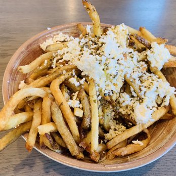 Kairos Mediterranean - a bowl of fries with cheese on top - Mediterranean Near Me - Columbia, South Carolina Kairos Mediterranean - a bowl of fries with cheese on top - Mediterranean Near Me - Columbia, South Carolina
