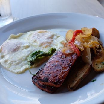Ama Ama Restaurant - His breakfast, porteguese sausage, two eggs and potatoes. - New American Near Me - Kapolei, Hawaii