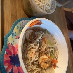 Spaghetti, a head of bok choy, sliced carrots, shrimp and some kind of broth.