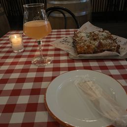 Table setting with pizza and beer