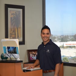 Pro Spine & Sport Solutions - Dr. Llantada in his office,