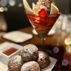 Oswego Grill - Banana Split + Doughnuts. The banana split has this silky creamy whip cream and the doughnuts are fresh and warm served with caramel sauce.