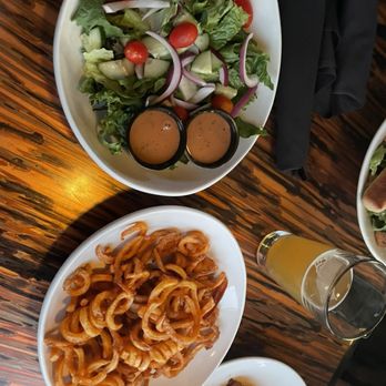 Uptown Grille - Side house salad and curly fries - American Near Me - Commerce Township, Michigan Uptown Grille - Side house salad and curly fries - American Near Me - Commerce Township, Michigan