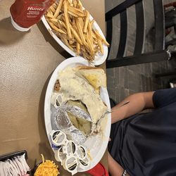Rockett Cafe & Club - Chicken fried steak plate with two sides- baked potato and fresh cut fries.
