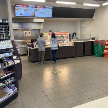 Mapco - a man and woman in a fast food restaurant - Gas Stations Near Me - Jackson, Tennessee