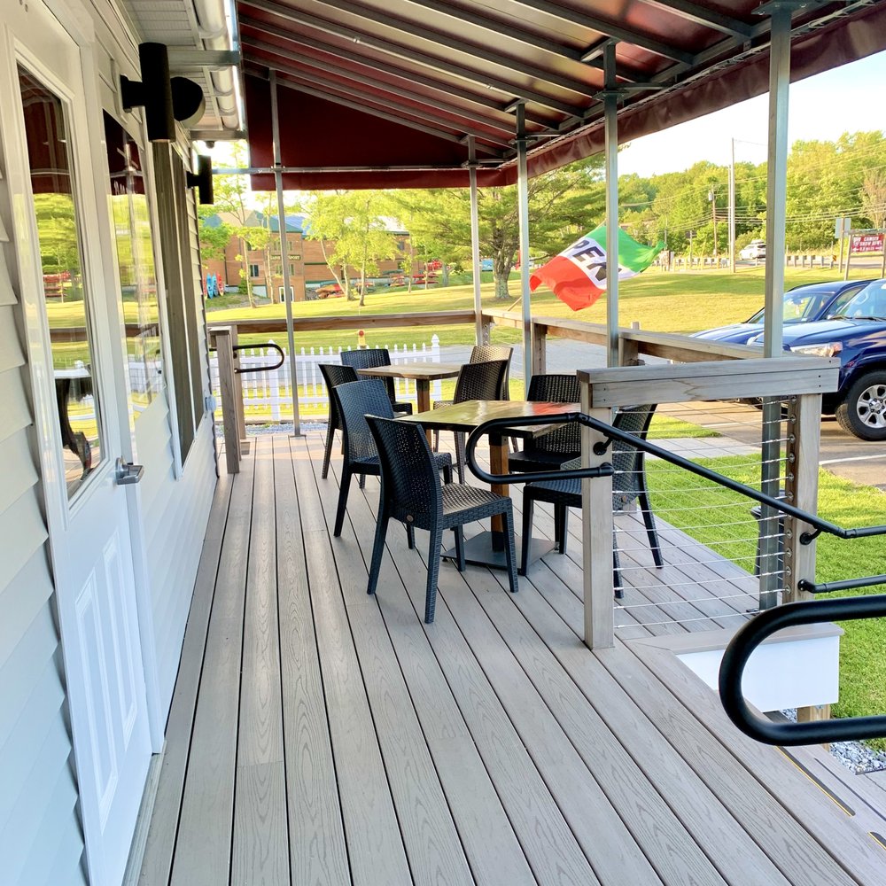 Ports Pizzeria - a patio with tables and chairs - Pizza Near Me - Rockport, Maine Ports Pizzeria - a patio with tables and chairs - Pizza Near Me - Rockport, Maine
