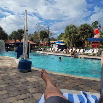 DoubleTree by Hilton - Main pool with tiki bar in the background - Hotels Near Me - Orlando, Florida DoubleTree by Hilton - Main pool with tiki bar in the background - Hotels Near Me - Orlando, Florida