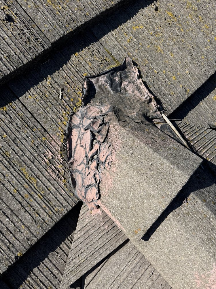 Slide of Nick’s Roofing