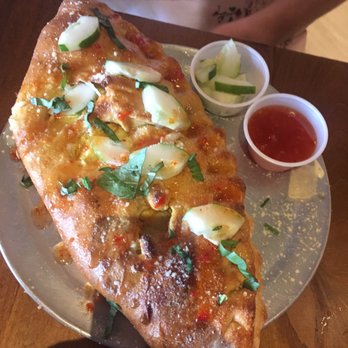 Mellow Mushroom Rocky River - Thai Dye calzone. Thai chicken and cucumbers. How do you even dream this up? - Pizza Near Me - Rocky River, Ohio Mellow Mushroom Rocky River - Thai Dye calzone. Thai chicken and cucumbers. How do you even dream this up? - Pizza Near Me - Rocky River, Ohio