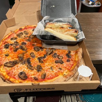 Flippers Pizza - A 16in thin crust cheese pizza with extra roasted mushrooms, and breadsticks. - Pizza Near Me - Tampa, Florida Flippers Pizza - A 16in thin crust cheese pizza with extra roasted mushrooms, and breadsticks. - Pizza Near Me - Tampa, Florida