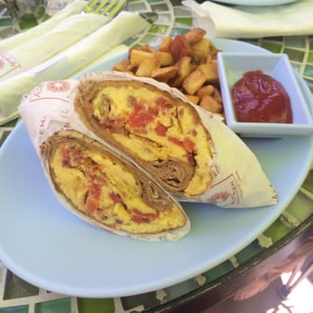 Rachel's Kitchen - Breakfast wrap with scrambled eggs, bacon, cheese, and tomatoes. Served with potatoes and ketchup. - Breakfast & Brunch Near Me - Henderson, Nevada Rachel's Kitchen - Breakfast wrap with scrambled eggs, bacon, cheese, and tomatoes. Served with potatoes and ketchup. - Breakfast & Brunch Near Me - Henderson, Nevada