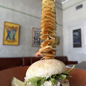 The Turtle Restaurant - Chicken salad on a sour dough bun with potato tornado in the Enoteca. - Comfort Food Near Me - Brownwood, Texas The Turtle Restaurant - Chicken salad on a sour dough bun with potato tornado in the Enoteca. - Comfort Food Near Me - Brownwood, Texas