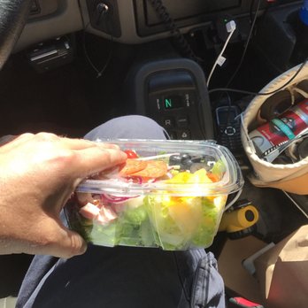 Palmisano's - a person holding a container of food - Delis Near Me - Baldwin, Maryland Palmisano's - a person holding a container of food - Delis Near Me - Baldwin, Maryland