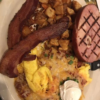 Lone Spur Cafe - Huevos rancheros with a side of ham steak. Tortillas are at the base of the eggs. - Cafes Near Me - Prescott, Arizona Lone Spur Cafe - Huevos rancheros with a side of ham steak. Tortillas are at the base of the eggs. - Cafes Near Me - Prescott, Arizona