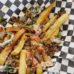French Me - Half eaten carne asada fries. Yum!