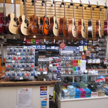 Guitar Stop - Picks & Acoustic Guitars by Fender, Takamine, Guild, & Ibanez Inside Guitar Stop Cambridge MA www.guitarstop.com - Musical Instruments & Teachers Near Me - Cambridge, Massachusetts