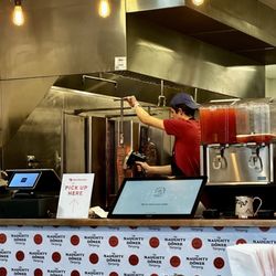 The Naughty Doner - Order screens and meat on spits.