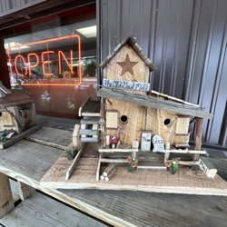 Andre Farms - Bird Houses and Plants out front