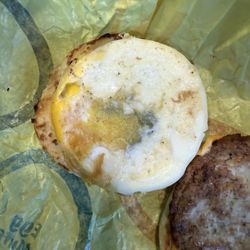 McDonald's - McMuffin yolk purposely broken and I don't know what the black is.
