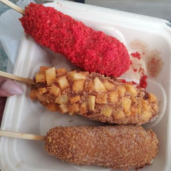 Mochi Lion - 3 different Korean corn dogs potato with half cheese and hot dog, cheetos half and half, and sugar sprinkled on the other. - Donuts Near Me - Riverside, California Mochi Lion - 3 different Korean corn dogs potato with half cheese and hot dog, cheetos half and half, and sugar sprinkled on the other. - Donuts Near Me - Riverside, California