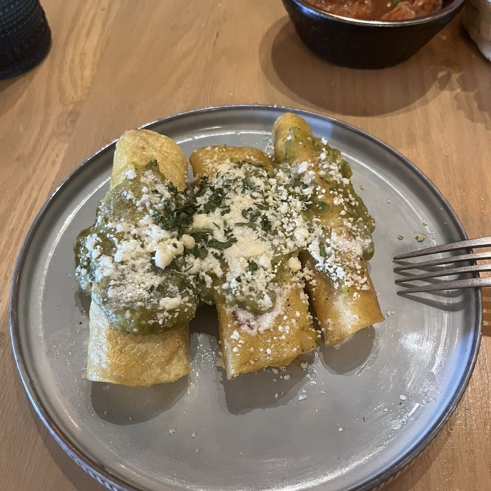 a plate of enchiladas on a table