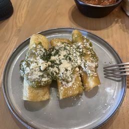 a plate of enchiladas on a table