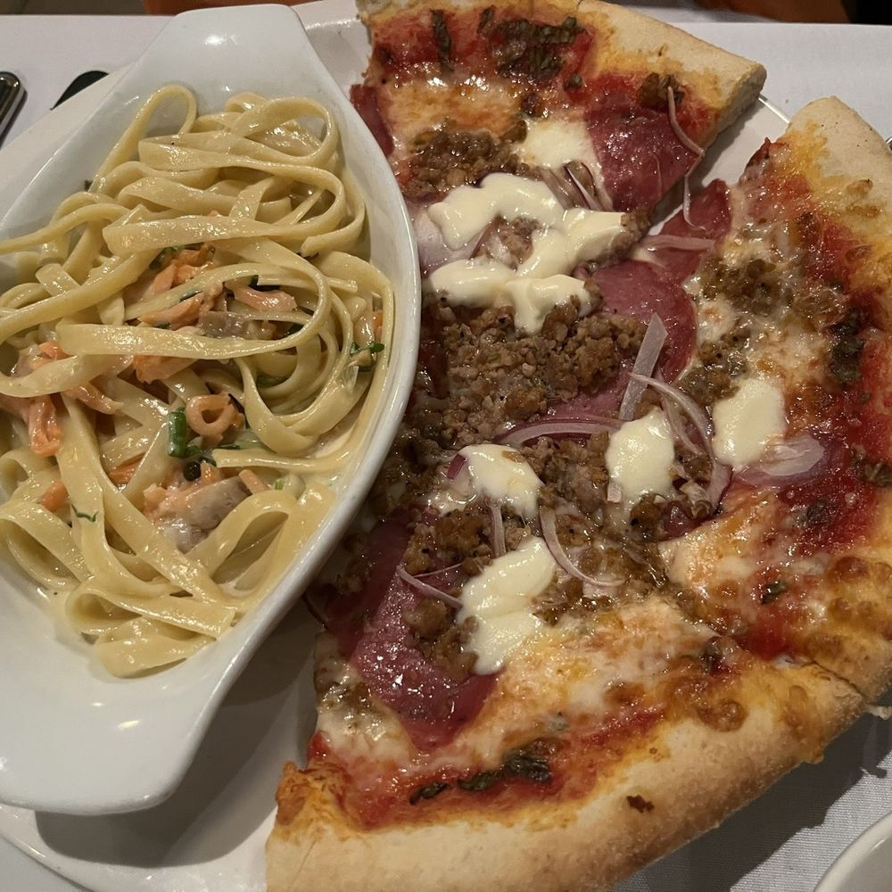 Meat lover pizza with salmon pasta. Meat lover pizza with salmon pasta.