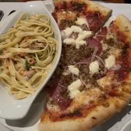 Meat lover pizza with salmon pasta. Meat lover pizza with salmon pasta.