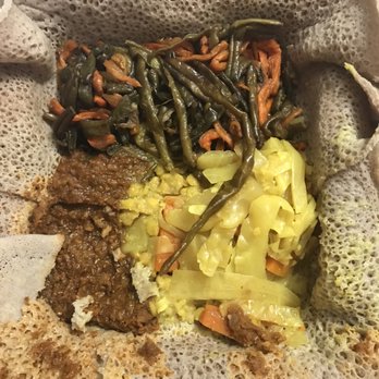 Ethiopis - Medium veggie plate- Spicy lentils, cabbage, chickpea underneath cabbage, and a double dose of green beans and carrots! 14.99 - Ethiopian Near Me - Rockville, Maryland Ethiopis - Medium veggie plate- Spicy lentils, cabbage, chickpea underneath cabbage, and a double dose of green beans and carrots! 14.99 - Ethiopian Near Me - Rockville, Maryland