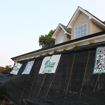 A-Team Roofing - "The Catch All" tarping system used to protect the house and plants from falling debris during the tear off. - Roofing Near Me - Berea, Kentucky A-Team Roofing - "The Catch All" tarping system used to protect the house and plants from falling debris during the tear off. - Roofing Near Me - Berea, Kentucky