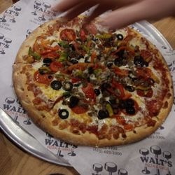 Walt's Pizza & Grille - The large pizza I got custom-made. Toppings are: black olives, bell pepper, ground beef, and pepperoni.