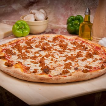 Original Italian Pizza - a pizza on a cutting board - Pizza Near Me - Syracuse, New York Original Italian Pizza - a pizza on a cutting board - Pizza Near Me - Syracuse, New York