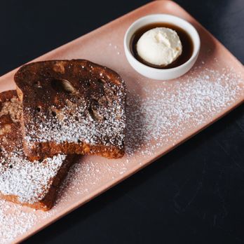 Toast + Tonic Creative Kitchen - a plate of french toast with powdered sugar - Breakfast & Brunch Near Me - Mystic, Connecticut Toast + Tonic Creative Kitchen - a plate of french toast with powdered sugar - Breakfast & Brunch Near Me - Mystic, Connecticut