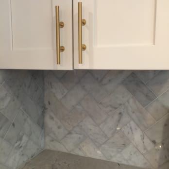 Grogan Construction - Herringbone white Carrara marble kitchen backsplash - General Contractors Near Me