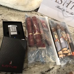 Mandarin Cigar Company - That's a cigar cutter and lighter combo. Pretty awesome and they clean and fill it whenever you want as a service for free