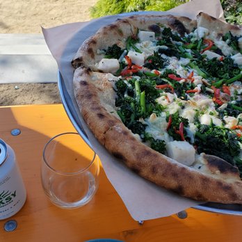 PizzaHacker - a pizza and a can of soda on a table - Pizza Near Me - Mill Valley, California