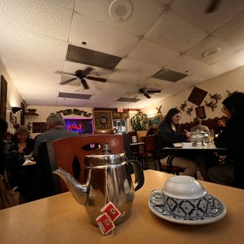 Thai House - a teapot and a cup on a table - Thai Near Me - Bakersfield, California Thai House - a teapot and a cup on a table - Thai Near Me - Bakersfield, California