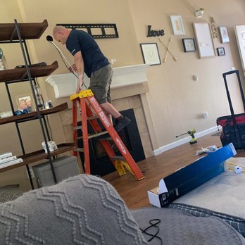 Pro Tech TV Installation - Hole drilled significantly to the left of the TV and unfortunately it shows from the side of it. - Home Theatre Installation Near Me