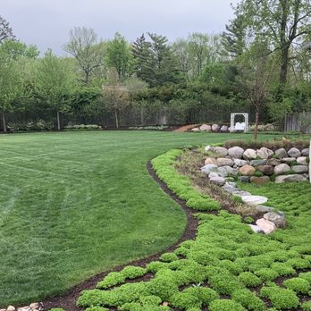 Landmark DBM - a green lawn with rocks and shrubs - Lawn Services Near Me - McCordsville, Indiana Landmark DBM - a green lawn with rocks and shrubs - Lawn Services Near Me - McCordsville, Indiana